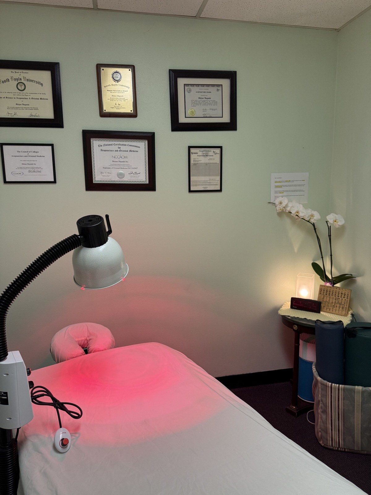 Private treatment room with a treatment bed at Shizue Acupuncture